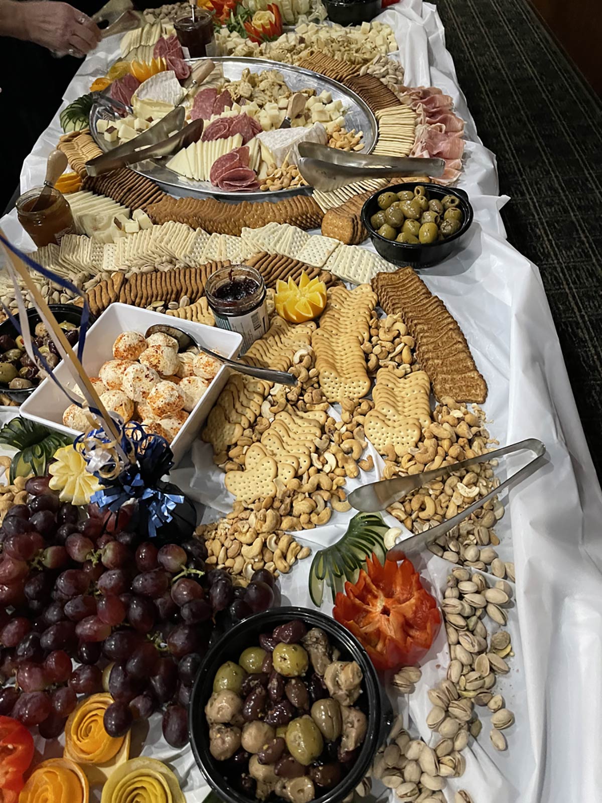 city centre events table with crackers and olives and grapes and nuts